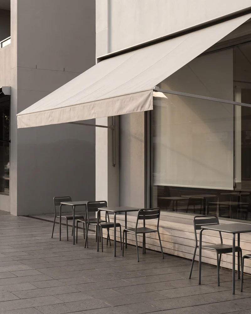 An awning over a footpath dining area