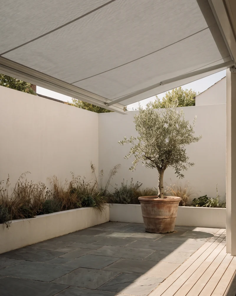 An awning shading a small walled courtyard