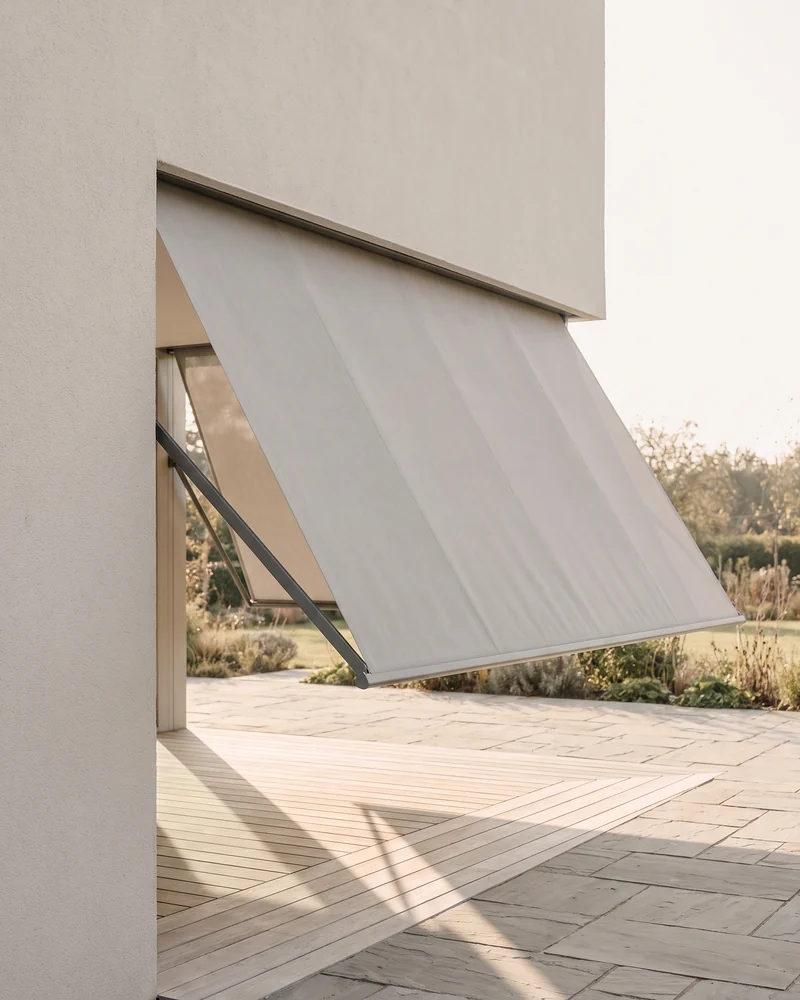 An awning-style outdoor blind shading a patio