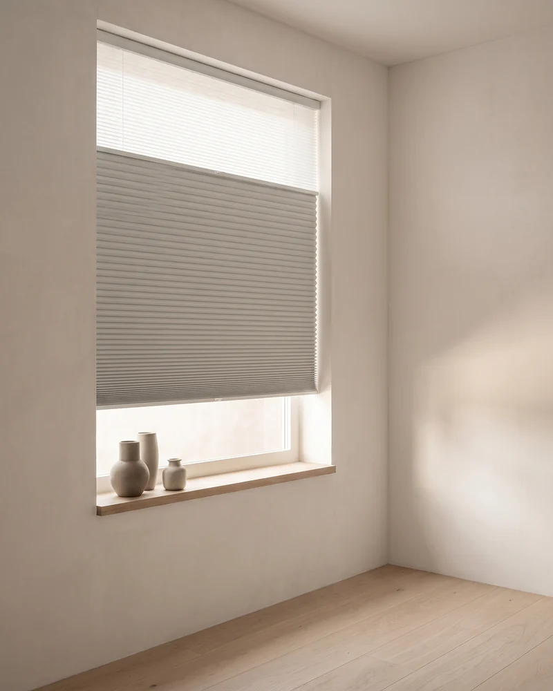 Blockout honeycomb blinds fitted to a bedroom window