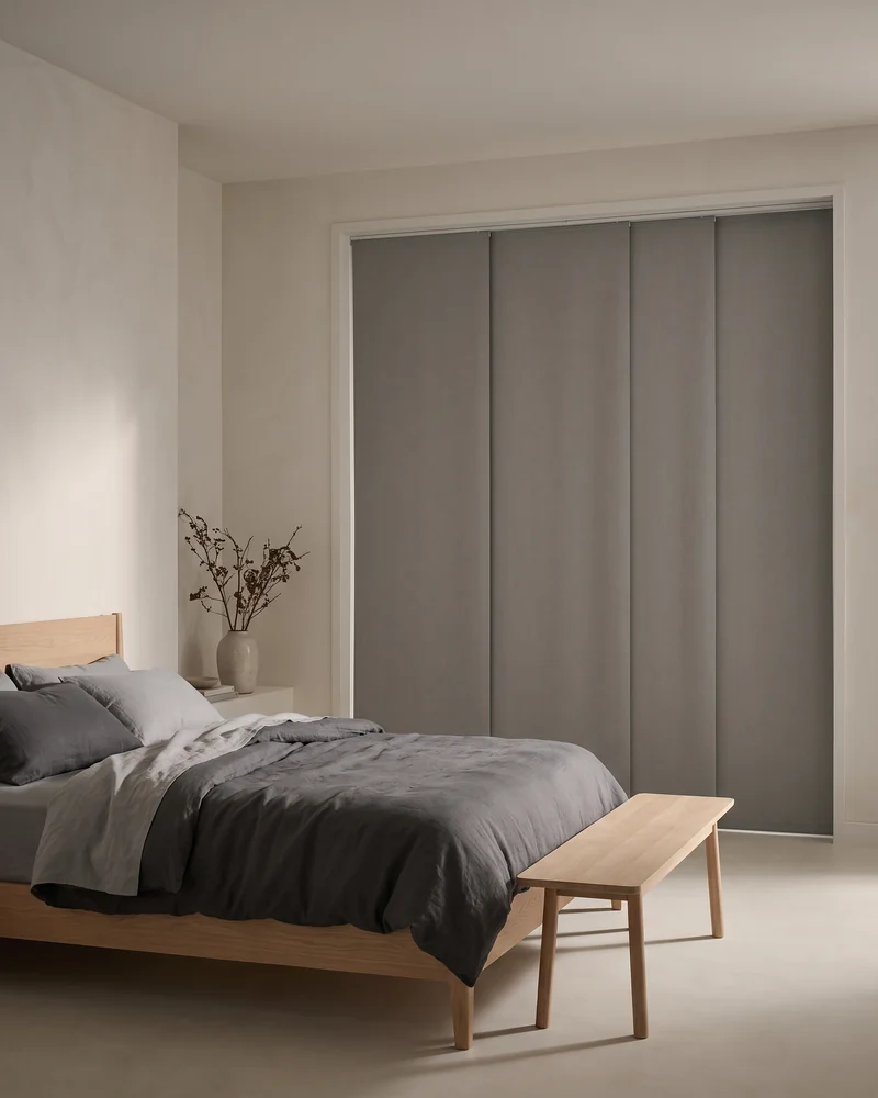 Blockout panel glides closed across a bedroom opening