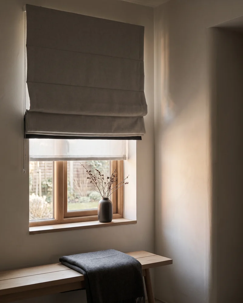 Blockout roman blinds in a warm living room