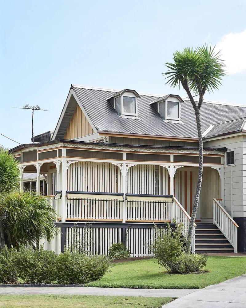 A Brisbane timber Queenslander with a deep wrap-around verandah