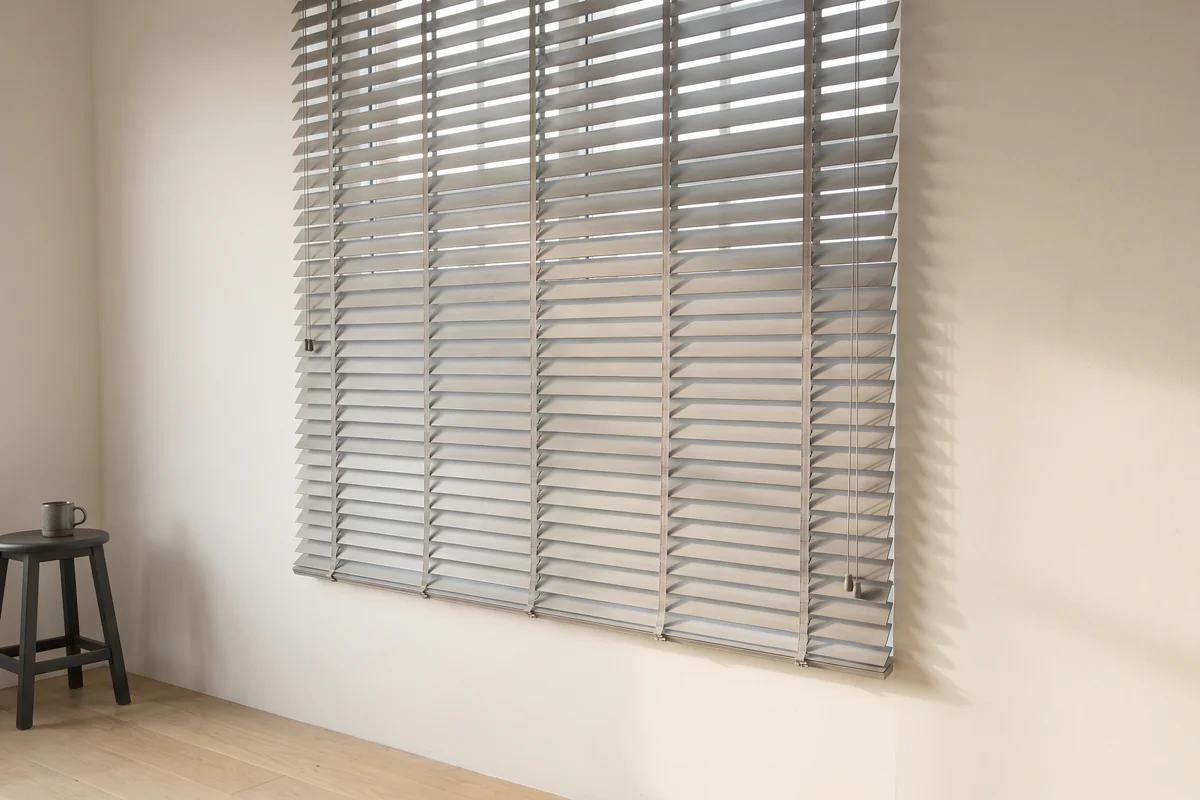 Closed venetian blind with the ladder cord running down each row of slats