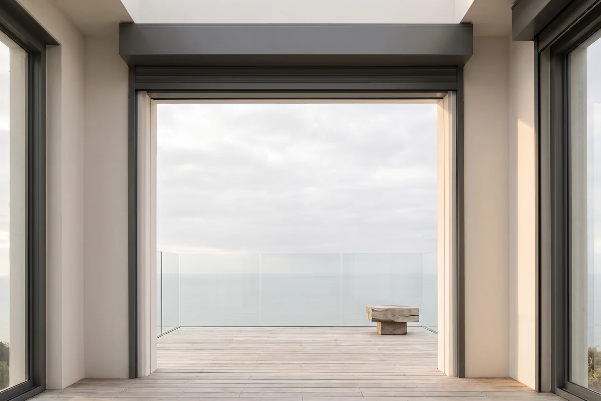 A coastal apartment balcony with an exposed outlook to open sky
