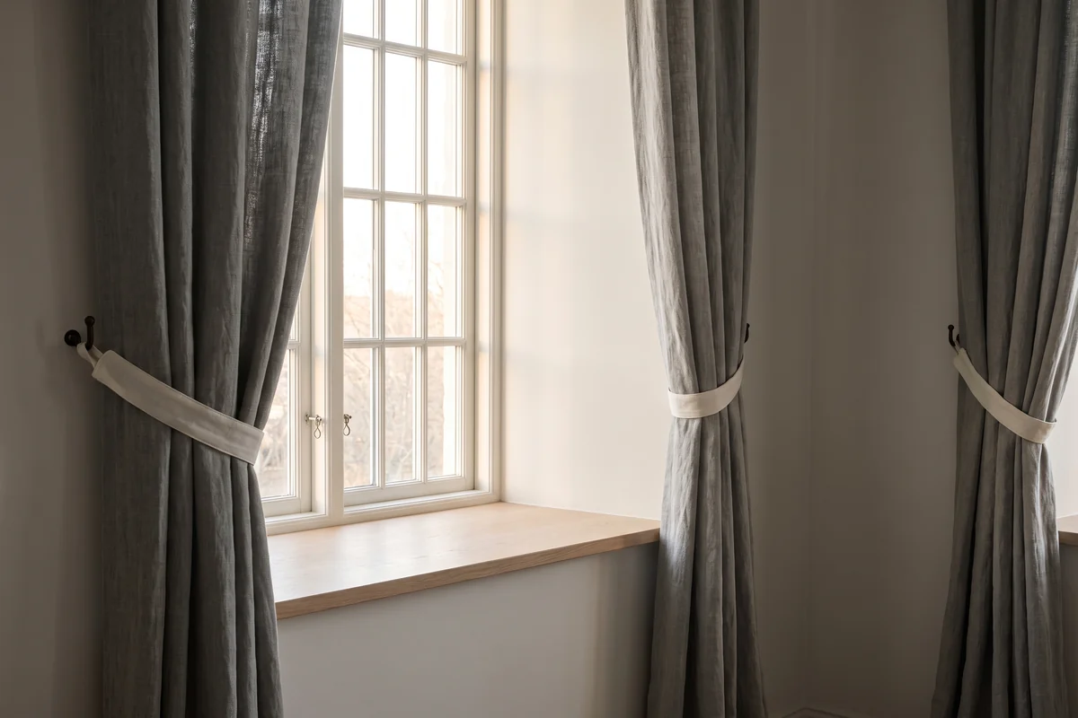 A fold pressed into heavy curtain fabric