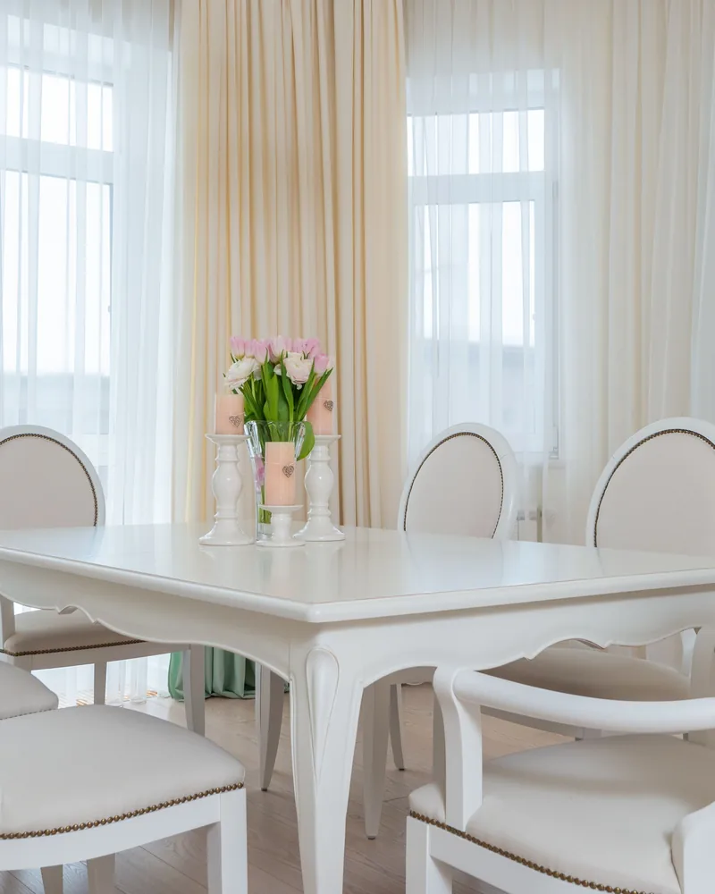 Curtains framing a dining room window