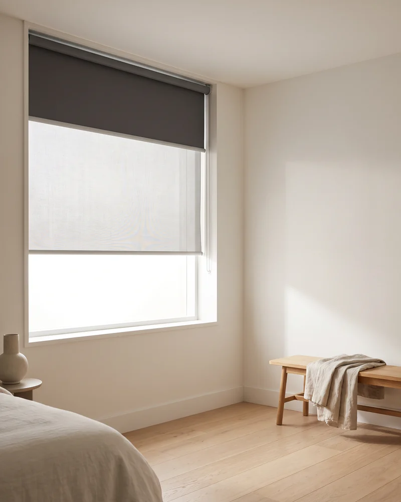 Dual roller blind pairing a sunscreen and a blockout on one bracket