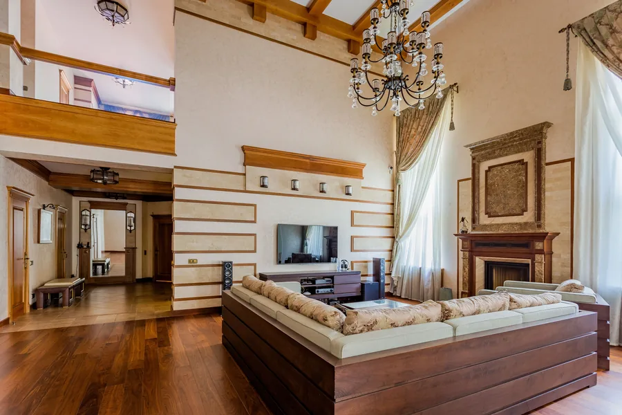 Elegant living room with full-length drapes at tall windows