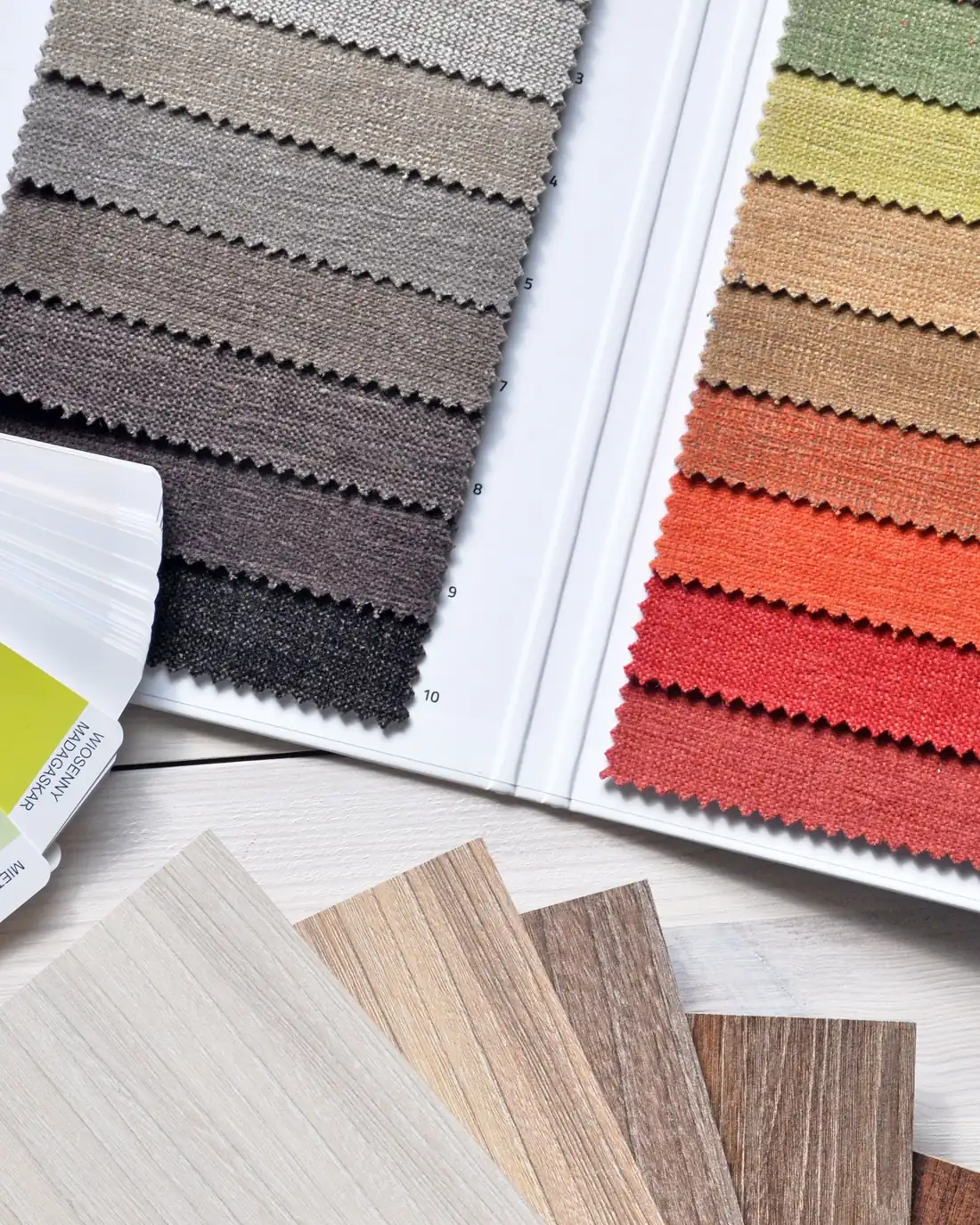 Fabric swatches laid out for choosing a curtain colour and weight