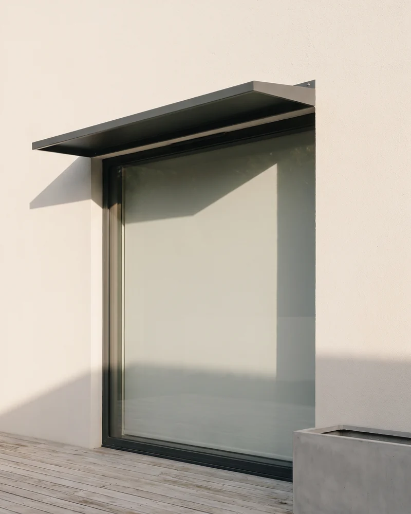 A fixed awning over a west-facing window