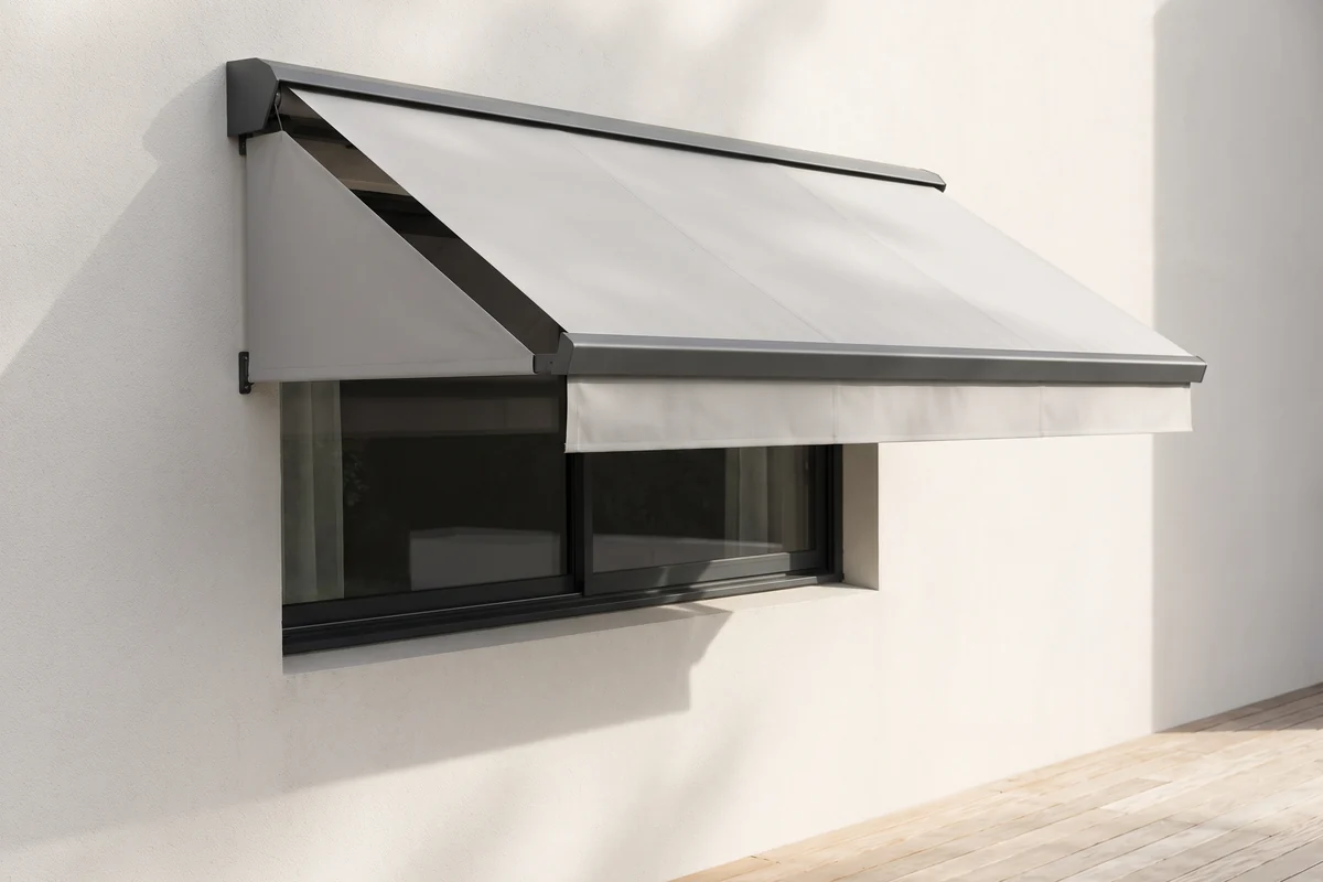 A fixed frame fabric awning mounted permanently above a single window