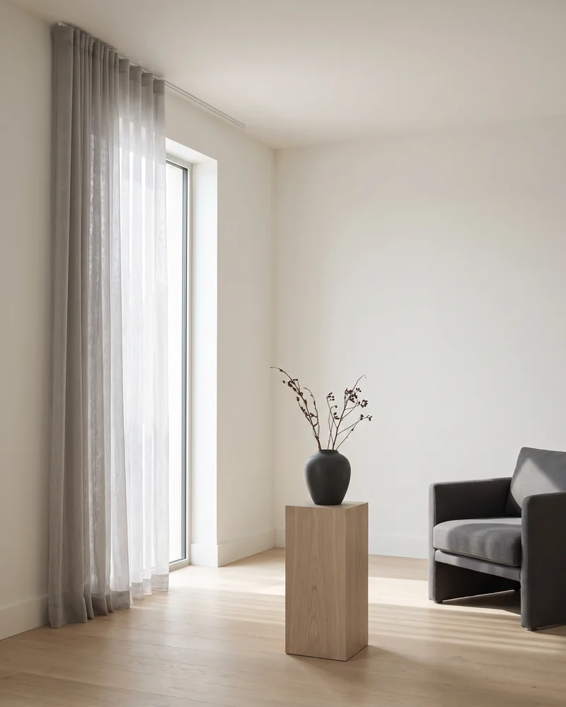 Floor-to-ceiling sheers on a tall window