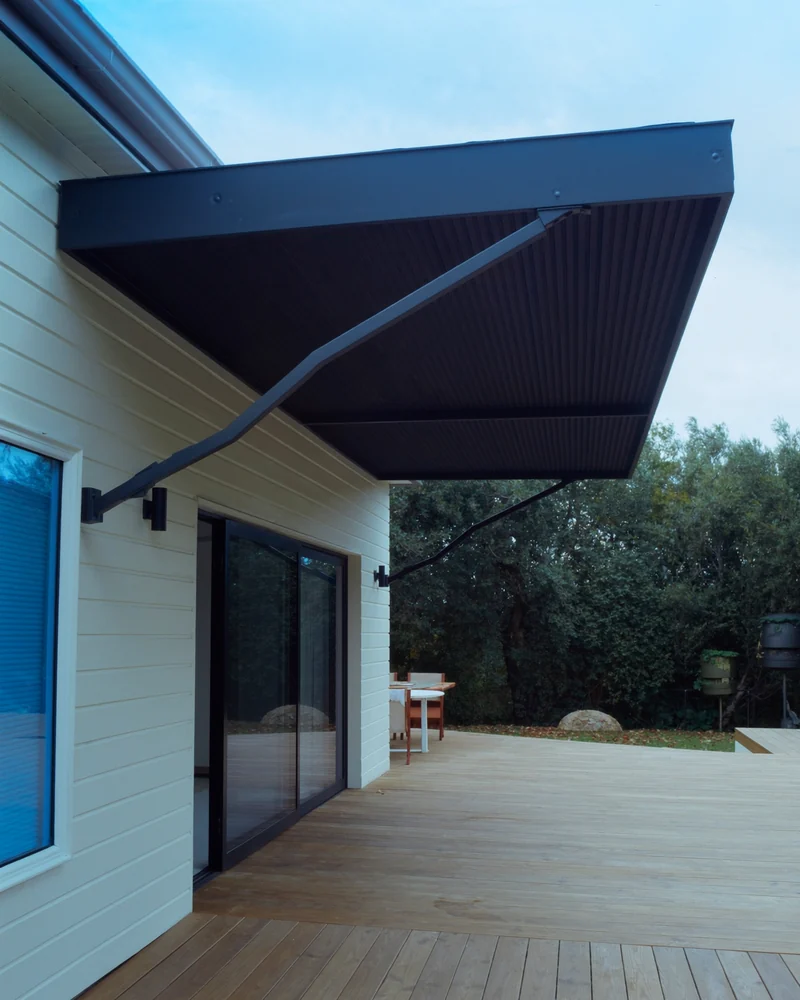 A folding arm awning shading a deck
