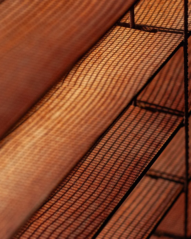 A mesh outdoor screen filtering afternoon light