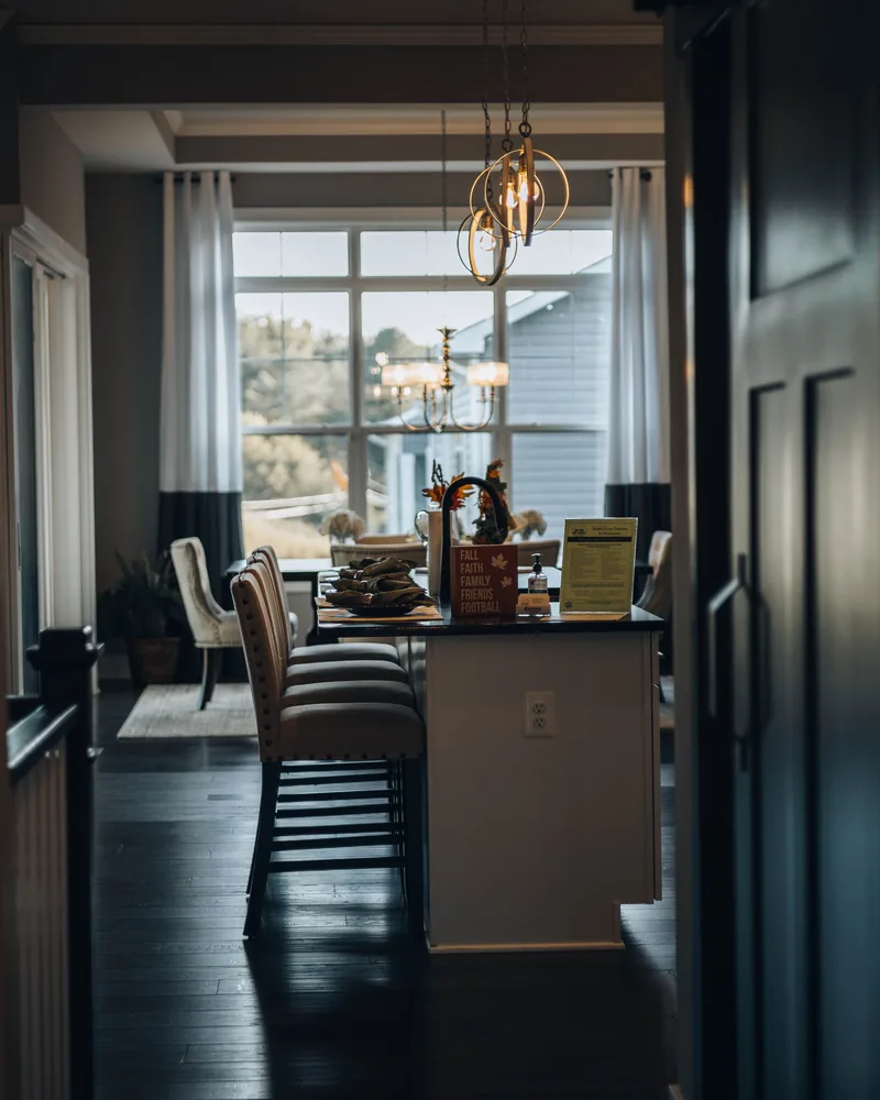 A modern kitchen with natural light at the window