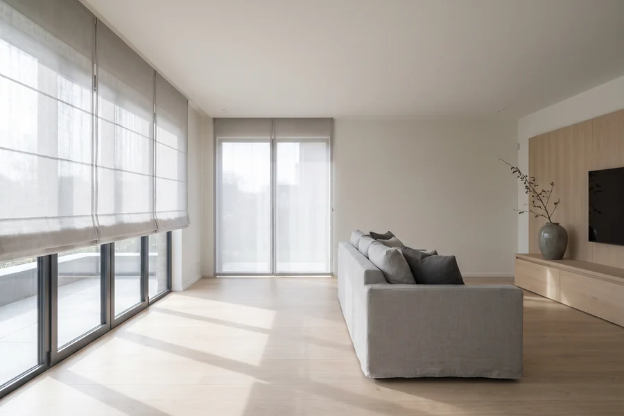 Modern living space with automated window treatments