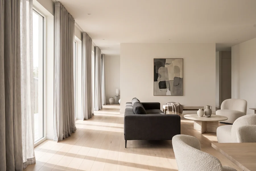 Open plan living room with tall windows