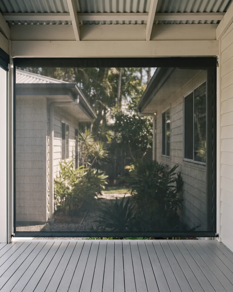 An outdoor blind shading an alfresco patio