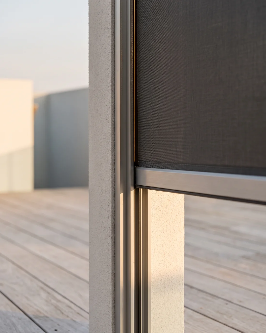 Close detail of an outdoor blind running in a side track