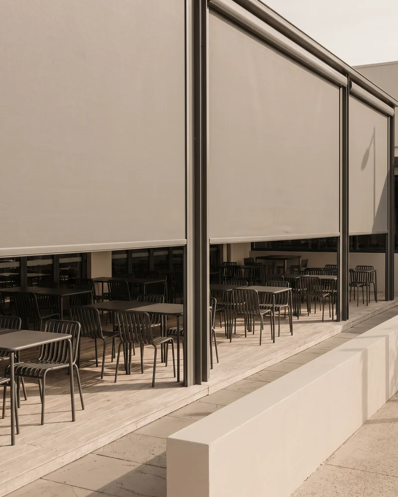 Outdoor blinds enclosing a commercial dining terrace