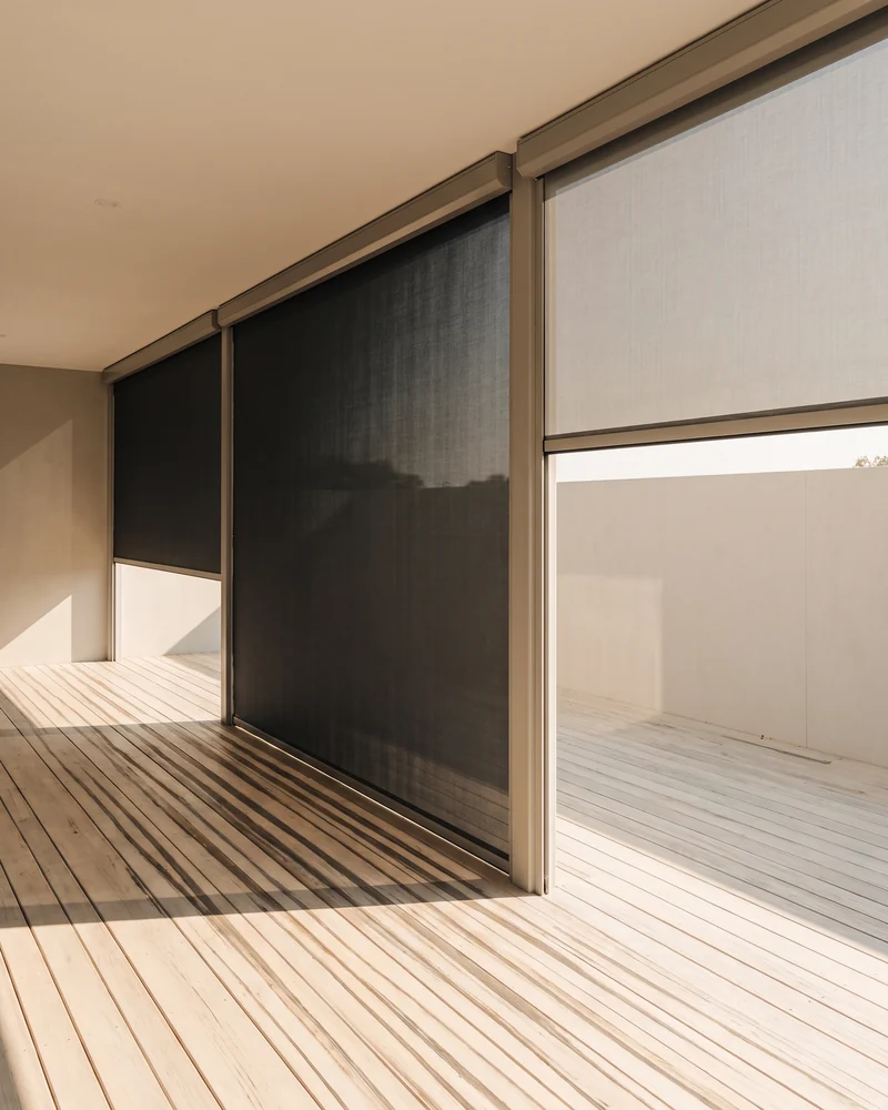 Outdoor blinds fitted along a timber deck