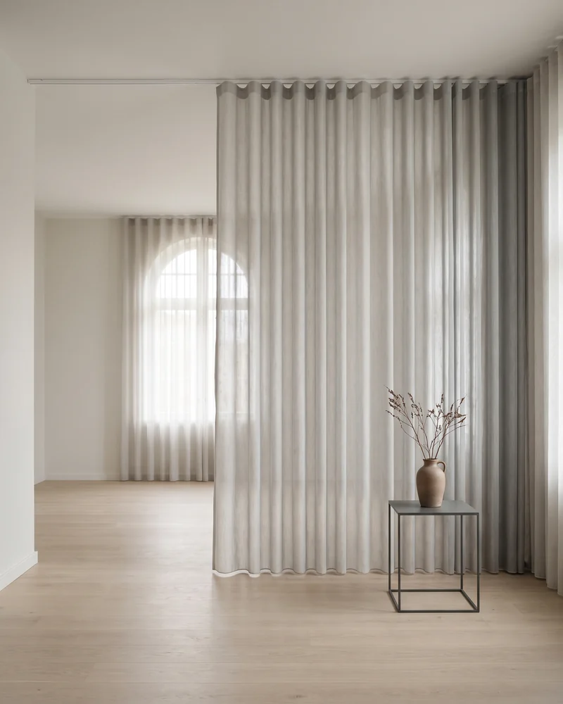 Panel glides used to divide an open-plan space