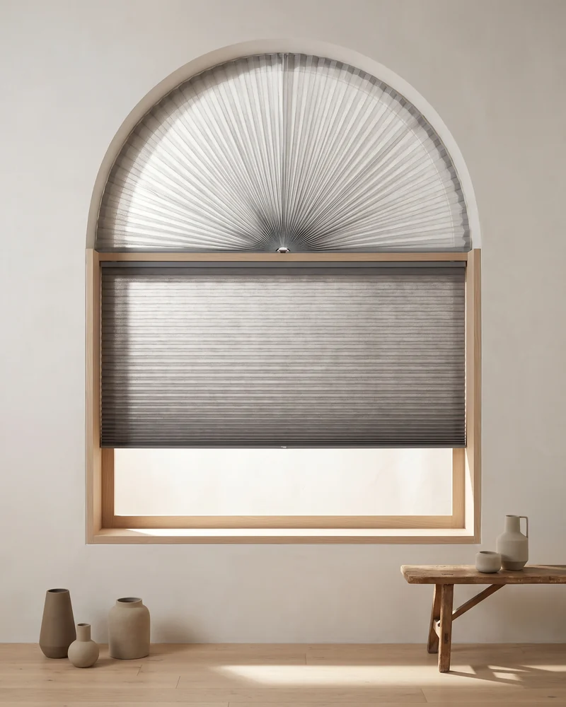 A pleated blind fitted to an arched window