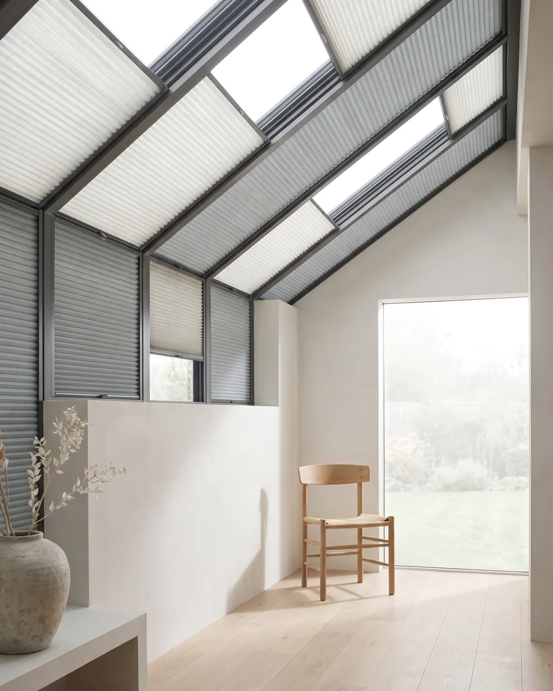 Pleated blinds fitted across a sunroom