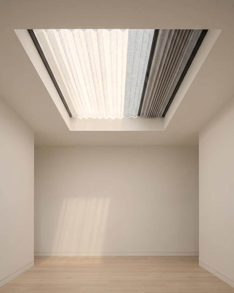 A pleated blind fitted to a skylight in a ceiling