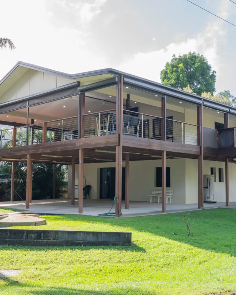 A raised Queensland house with a deep timber deck