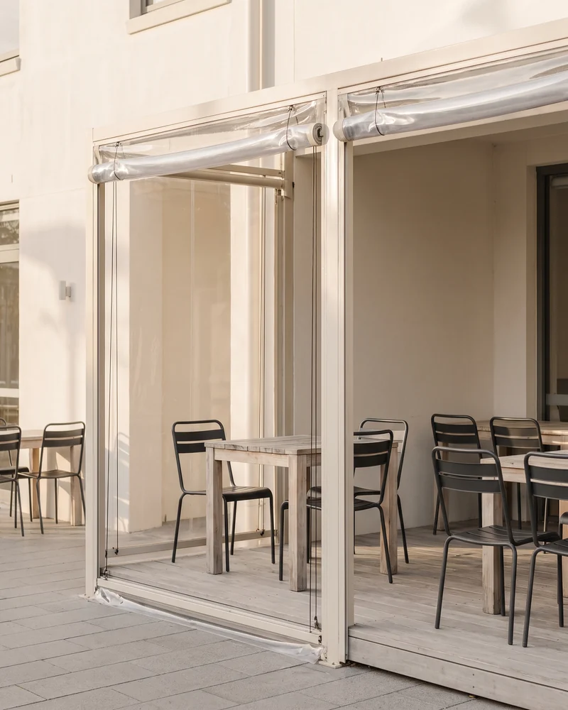 Restaurant terrace enclosed with clear caf&eacute; blinds