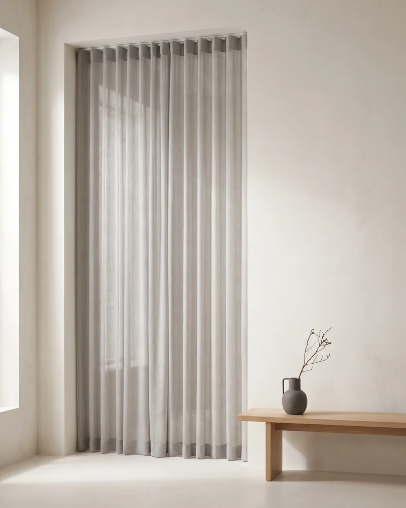 Reverse pleat sheer curtains in a tailored heading