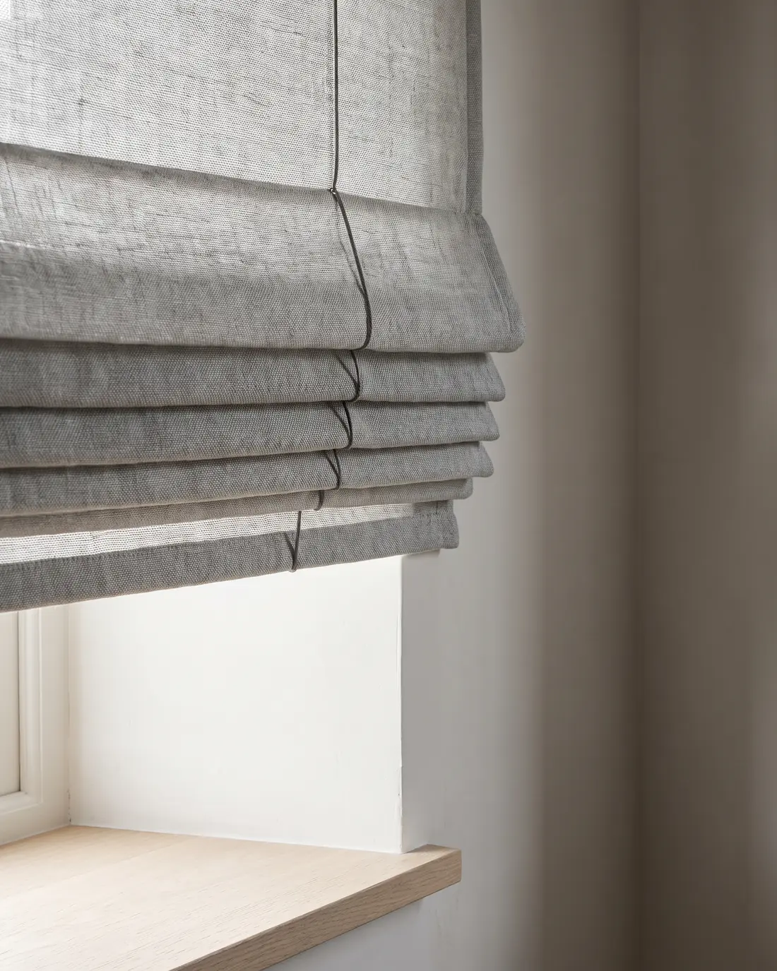 Close detail of the folds on a Roman blind
