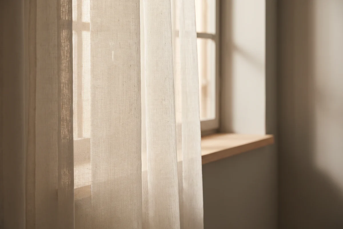 Sheer curtain fabric catching afternoon light