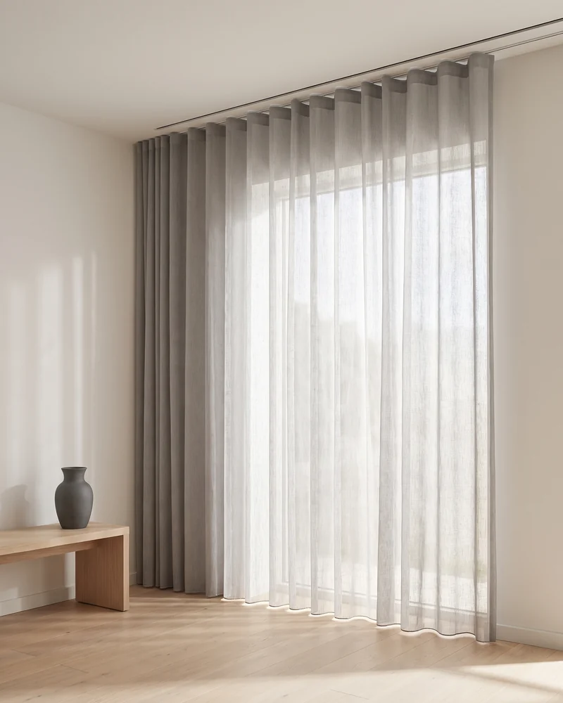 SilverScreen curtain fabric hung on a runnered track
