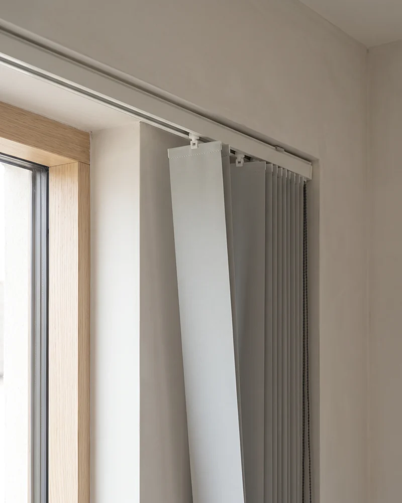 A single vertical louvre being replaced in an existing track