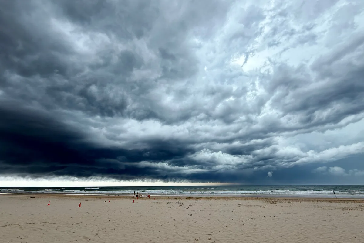 Storm cloud building over a coastal Queensland suburb