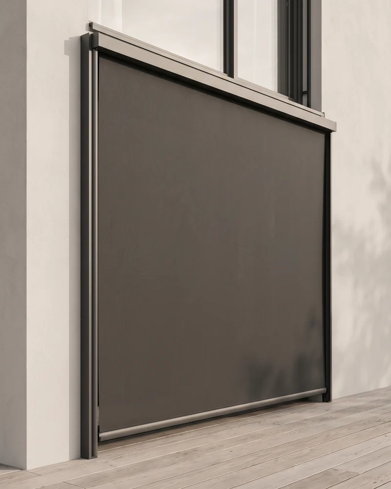 A straight-drop awning lowered over a window