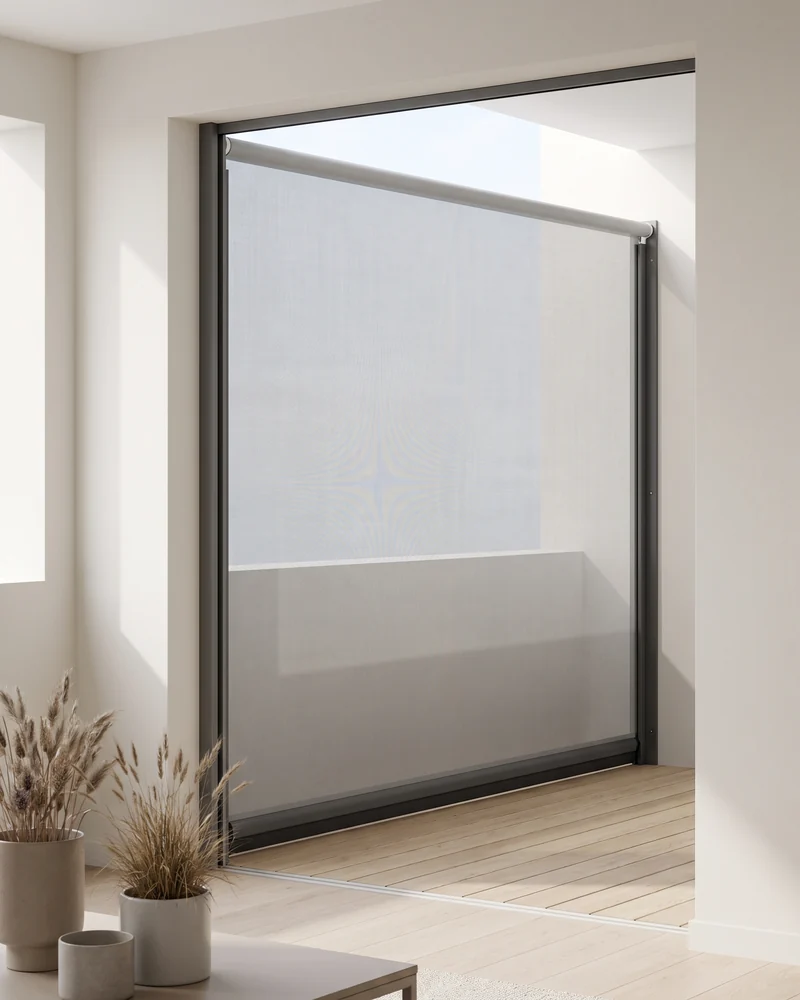 Track-guided outdoor blind on a coastal balcony