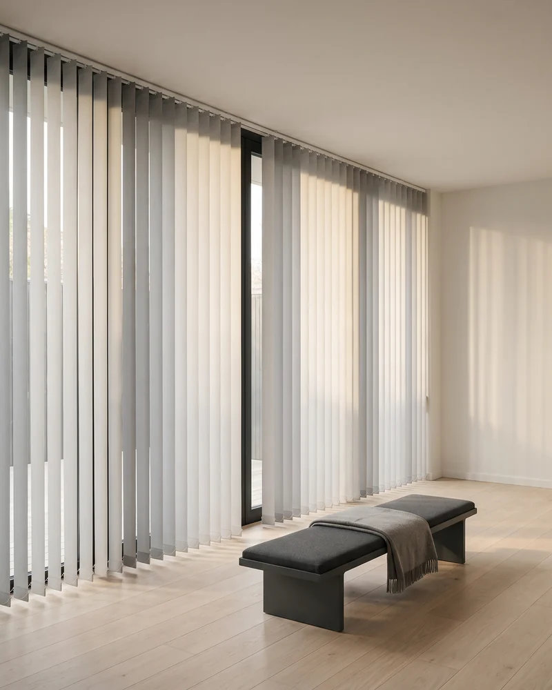 Vertical blinds running across a wide span of glass